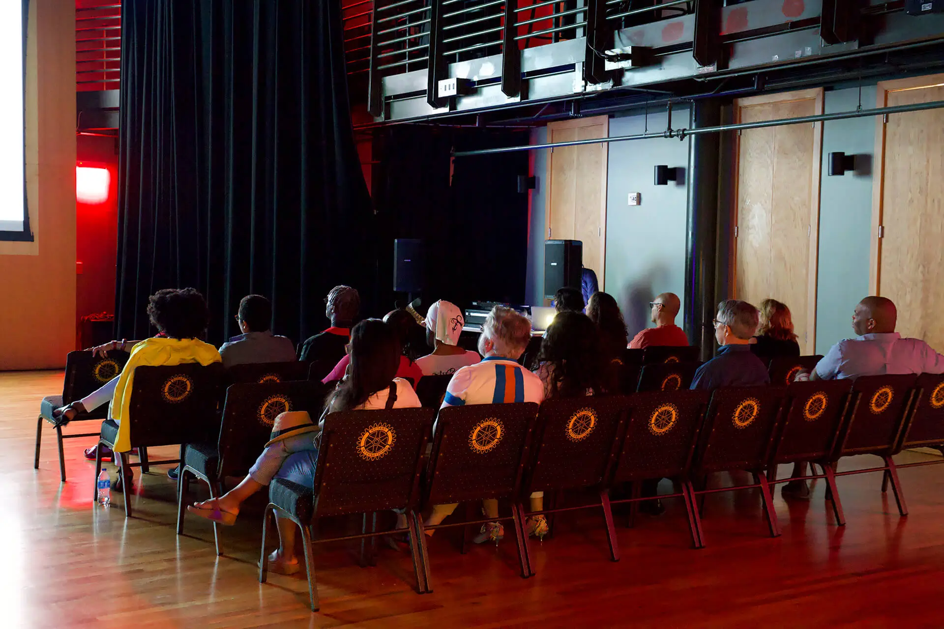 Audience watching a short film at The Sacred Underground Film Festival 2024